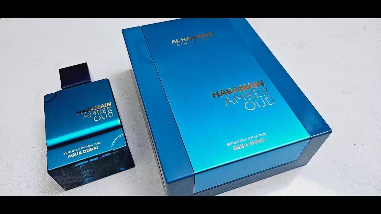 Blue Al Haramain perfume bottle and packaging on a white background