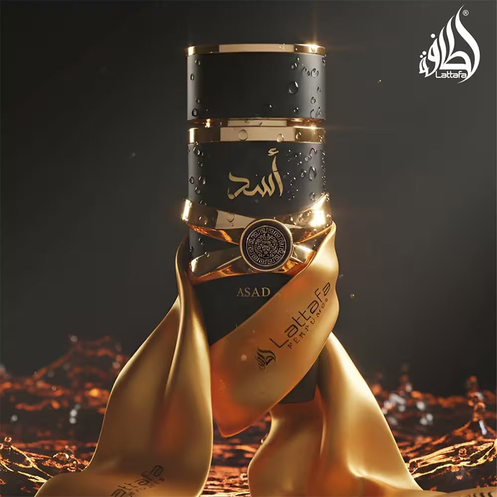 Perfume bottle with gold ribbon against a dark background, featuring the Lattefa brand.