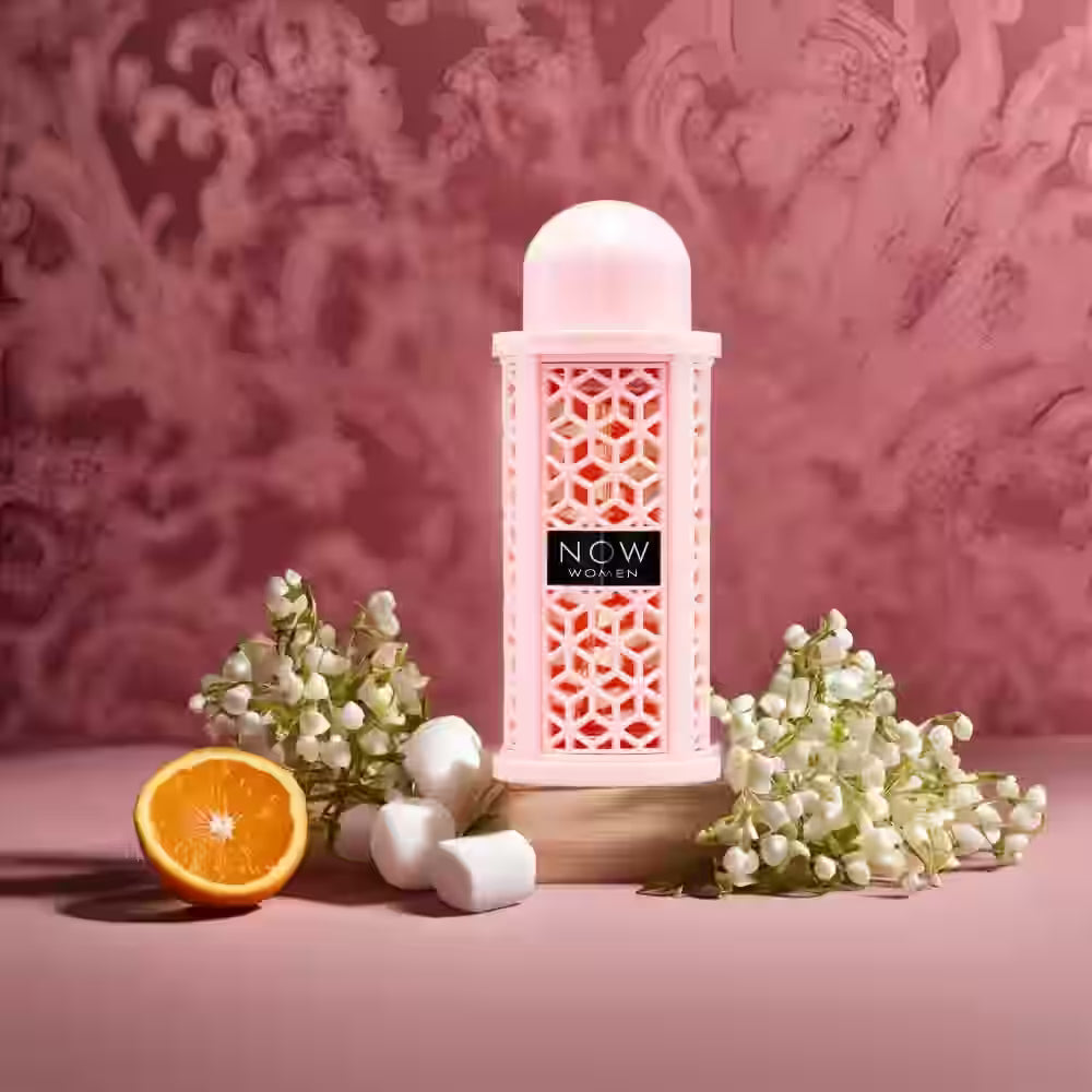 Decorative lantern with floral arrangements and an orange on a pink background