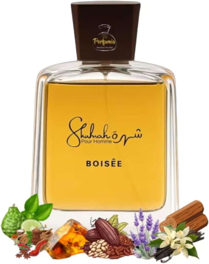 A bottle of Shah-eh-goo Pour Homme Boisée fragrance by Perfumia, featuring a clear glass bottle with golden amber liquid, a dark brown cap, and a matching dark brown label. The bottle is centered on a white background, with decorative illustrations of natural ingredients (cinnamon, lavender, citrus, cocoa, and flowers) arranged along the bottom edge.