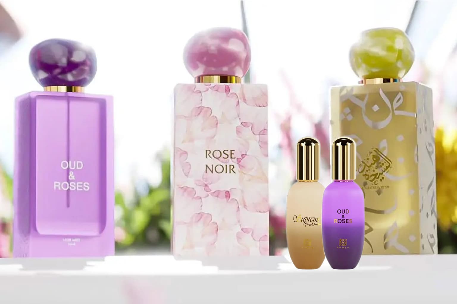 Collection of perfume bottles with colorful caps on a blurred natural background