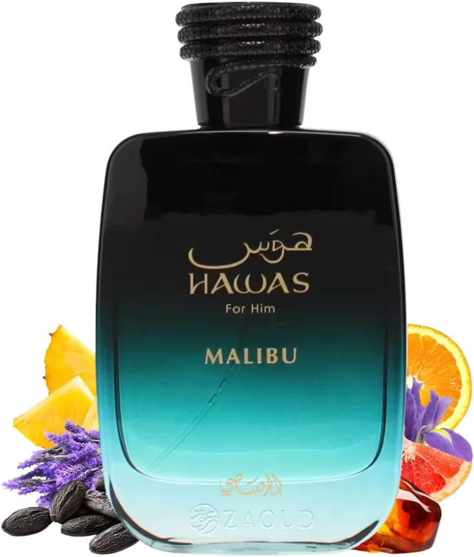 A bottle of Zaloq Nawas For Him Malibu fragrance, featuring a black-to-blue gradient glass bottle with gold lettering, surrounded by decorative citrus slices, purple flowers, and coffee beans on a white background.