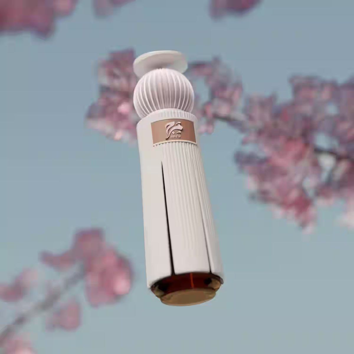 A white cylindrical bottle or container with ribbed detailing and a small gold label featuring a lion head logo, shown against a soft-focus background of pink blossoms and a pale blue sky.