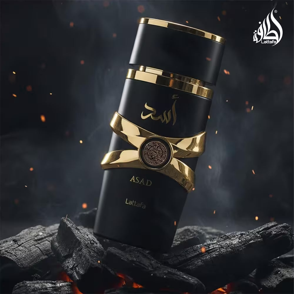Black and gold ASAD Latifa product on a dark background with flames and smoke.