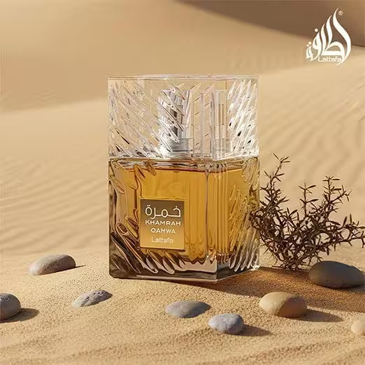 Perfume bottle with desert landscape and brand logo